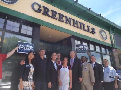 Cindy and Dermot Quinn, owners of Greenhills Bakery, pose with Dorchester elected officials Michelle Wu, Stephen Lynch, Warren Tolman, Steven Tompkins, Daniel Cullinane, and Frank Baker outside the bakery early Monday afternoon. 	Photo by Lauren Dezenski